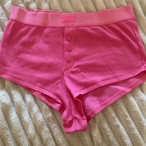 Skims cotton rib shorts in a hot pink color